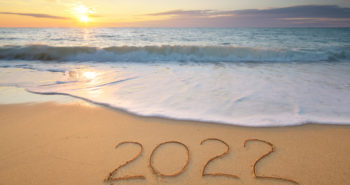 2022 year on the sea shore during sunset. Element of design.