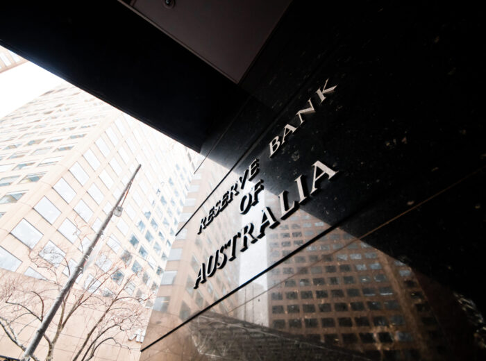 MELBOURNE, AUSTRALIA - JULY 26, 2018: Reserve Bank of Australia name on black granite wall in Melbourne Australia with a reflection of high-rise buildings. The RBA building is located at 60 Collins St, Melbourne VIC 3000 Australia.