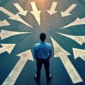 Man stands at crossroads. Many arrows point in different directions. Seems indecisive confused about options. Choices, decisions key concepts. Considering different paths, possibilities in life