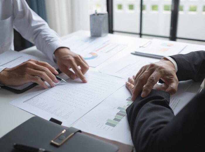 Business investor analyzing a valuation data forecast a investment project